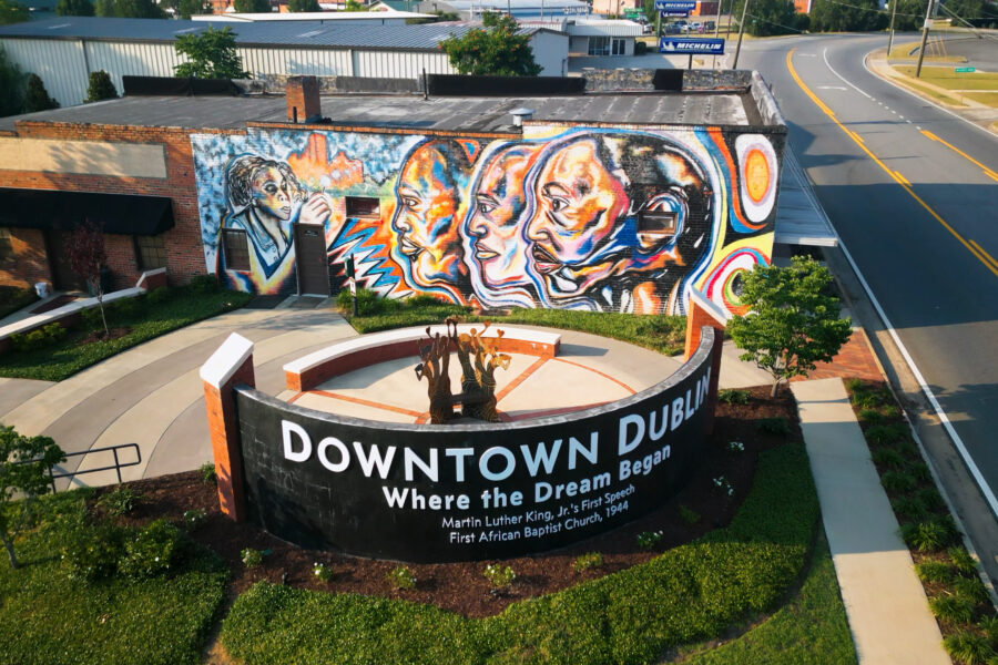 Aerial view of MLK Monument Park showing lush landscaping and colorful mural wall.
