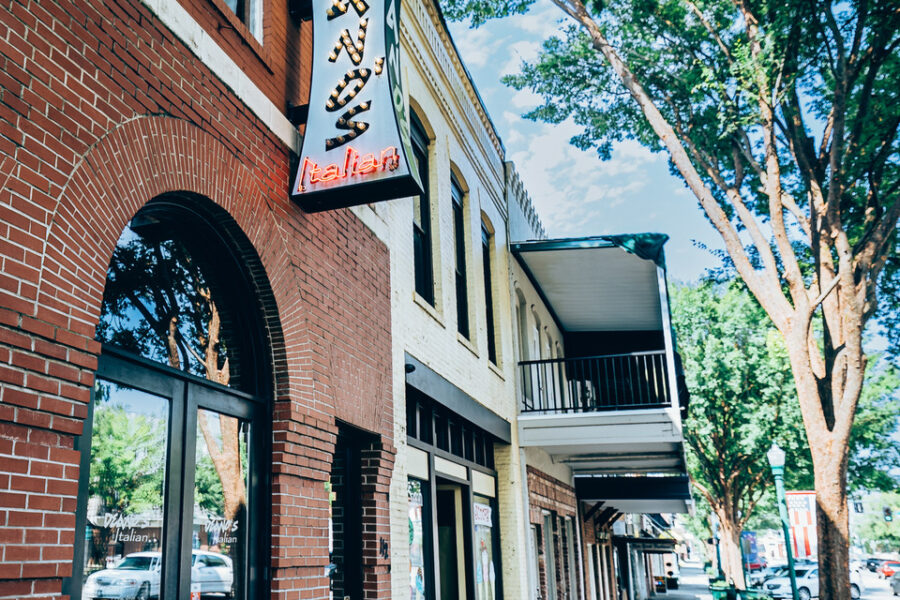 exterior of Deano's Italian including neon sign
