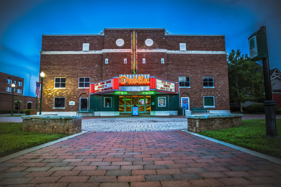 front of Theatre Dublin at dusk with brightly lit Dublin neon