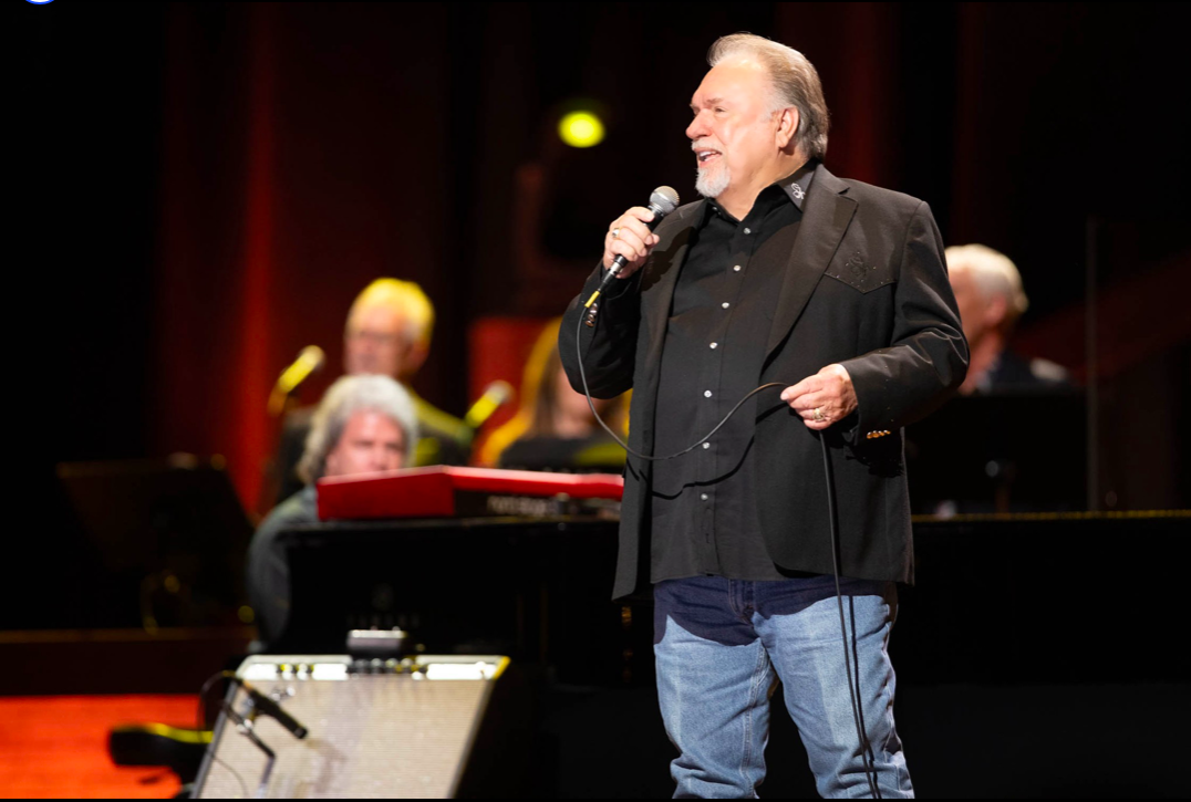 Gene Watson performing on stage