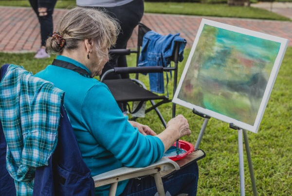 Member of Art Dublin painting en plain air at Dublin's Chili Cookoff.