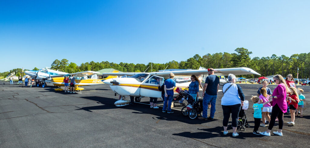 spectators looking at airplanes at Wheels and Wings event in Dublin Georgia.