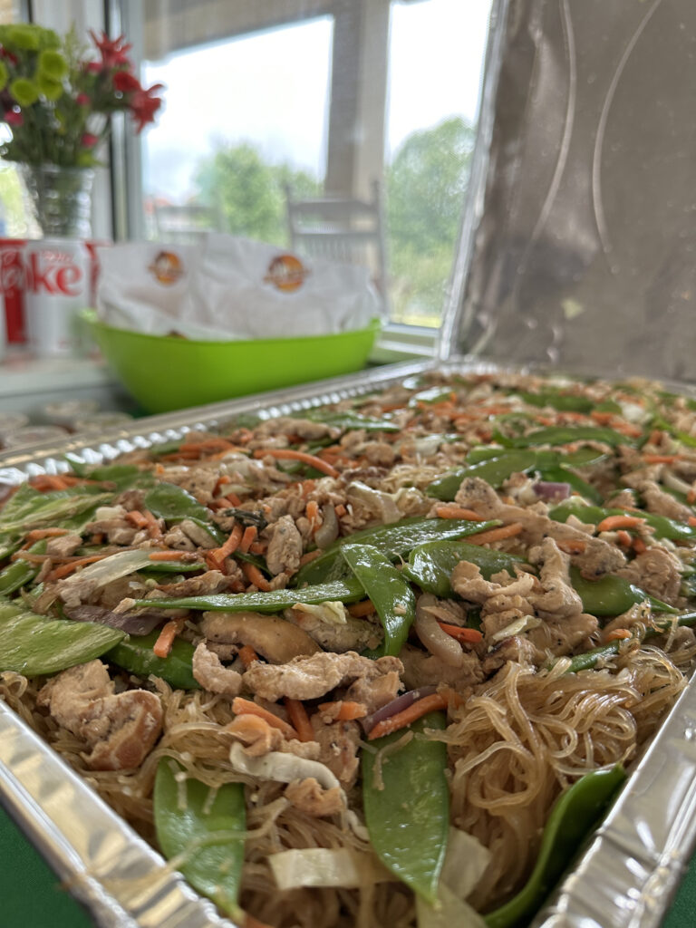 A large pan of chicken panic bihon catered for a meeting by Shuga Nickles.