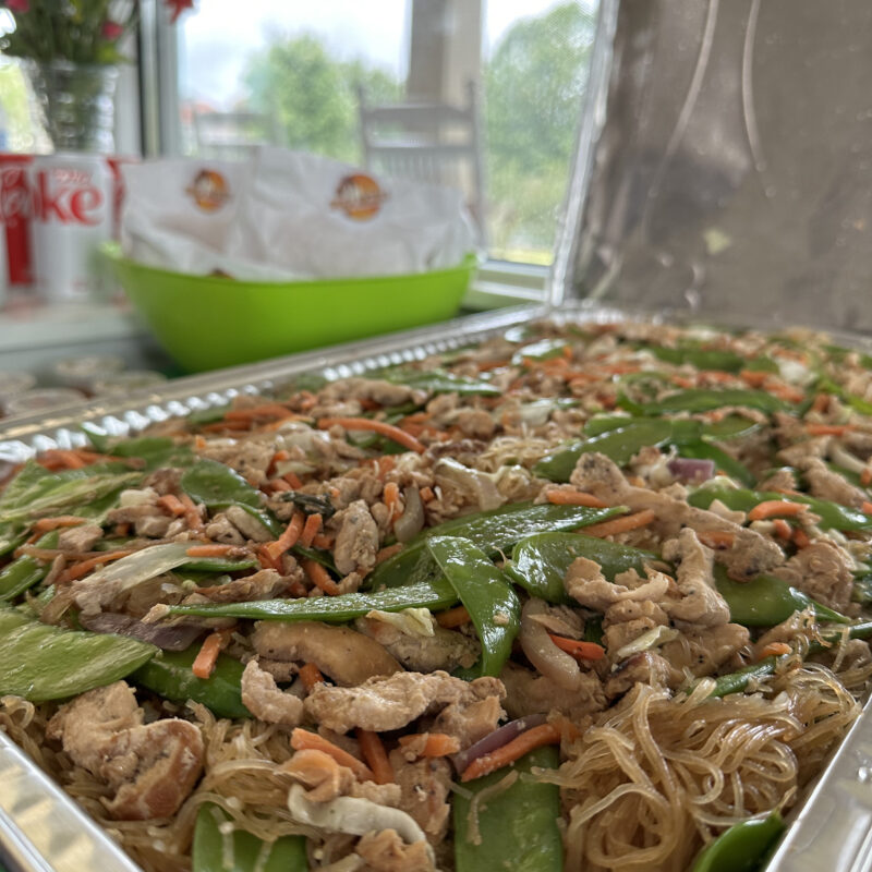 A large pan of chicken panic bihon catered for a meeting by Shuga Nickles.