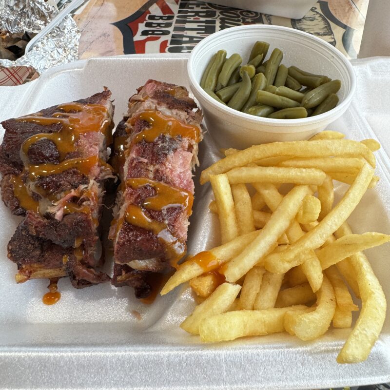 Smoked rib plate at Southern Heritage BBQ with green beans and French fries on the side.