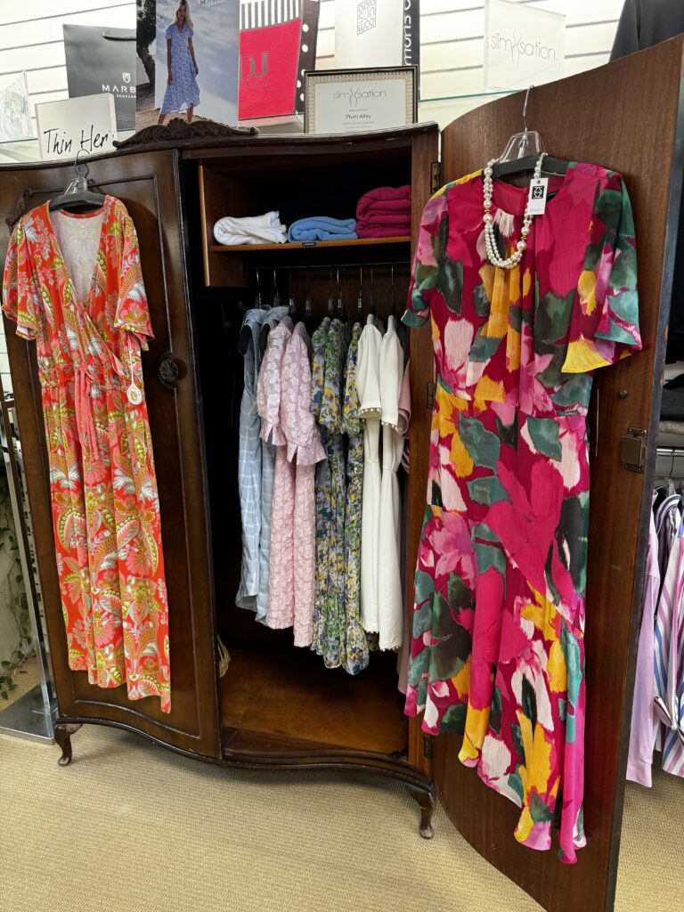 A bureau filled with dresses at Plum Alley
