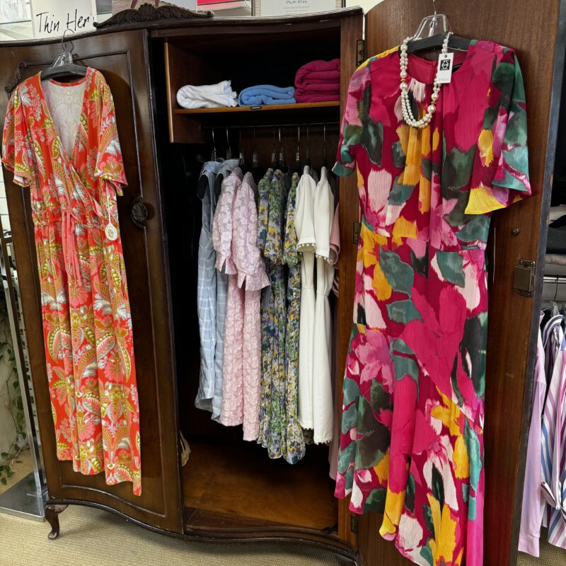 A bureau filled with dresses at Plum Alley