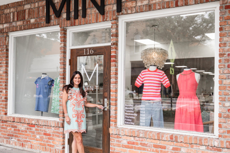 Mint Boutique owner Laura standing at the door of the Mint storefront.