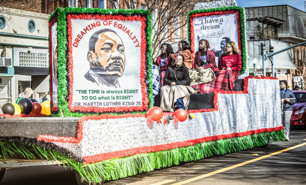 Float with MLK, jr's face riding through the Annual Martin Luther King, Jr. Parade