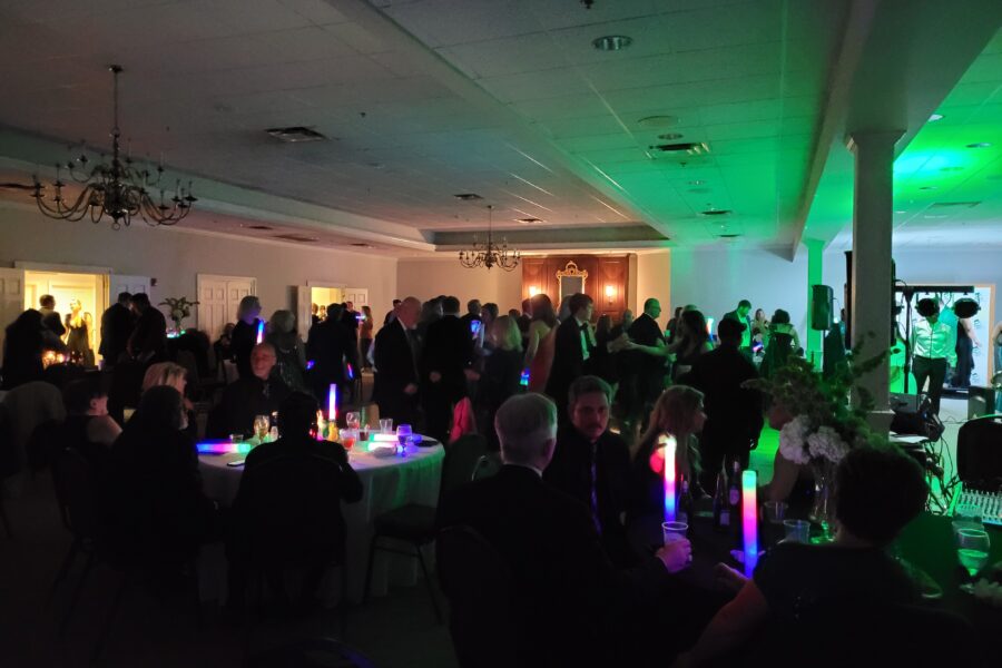 People enjoying live music on the dance floor at St. Patrick's Gala.