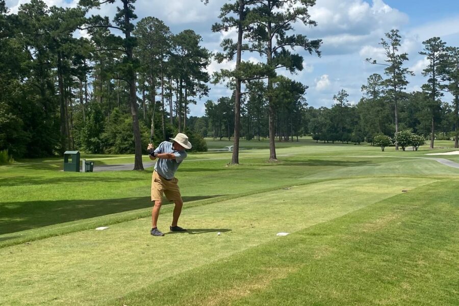 Golfer teeing off at Dublin Country Club for Golf Tournament.