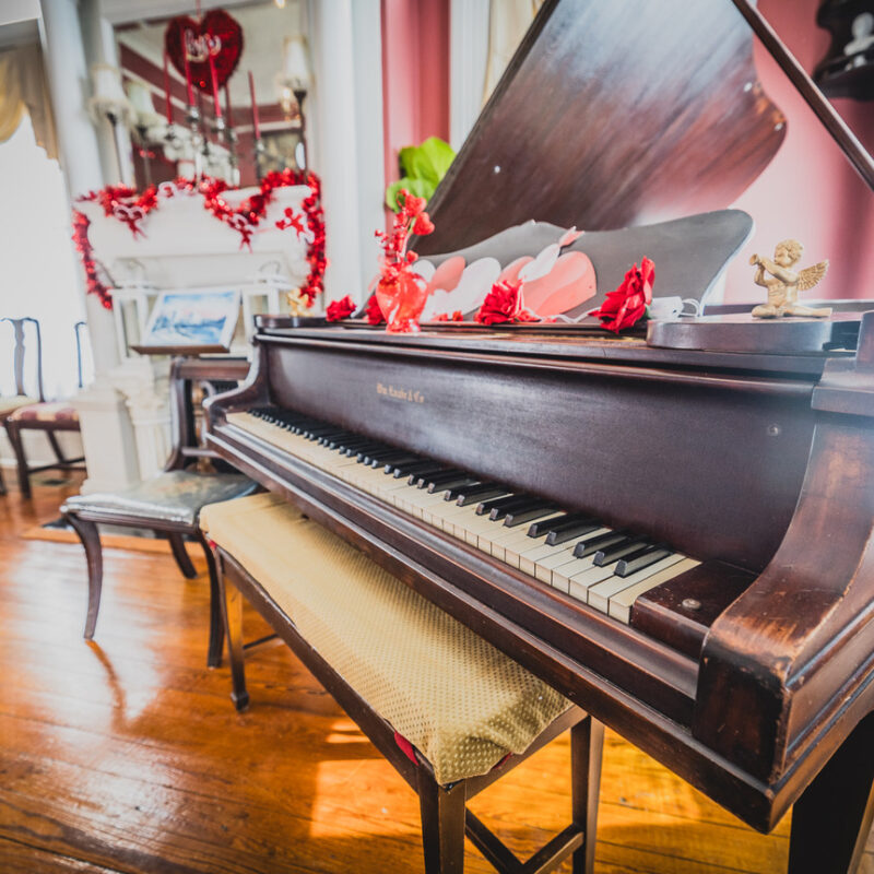 Piano at the Page House decorated with Valentine's Day decor - Flirty and fun events