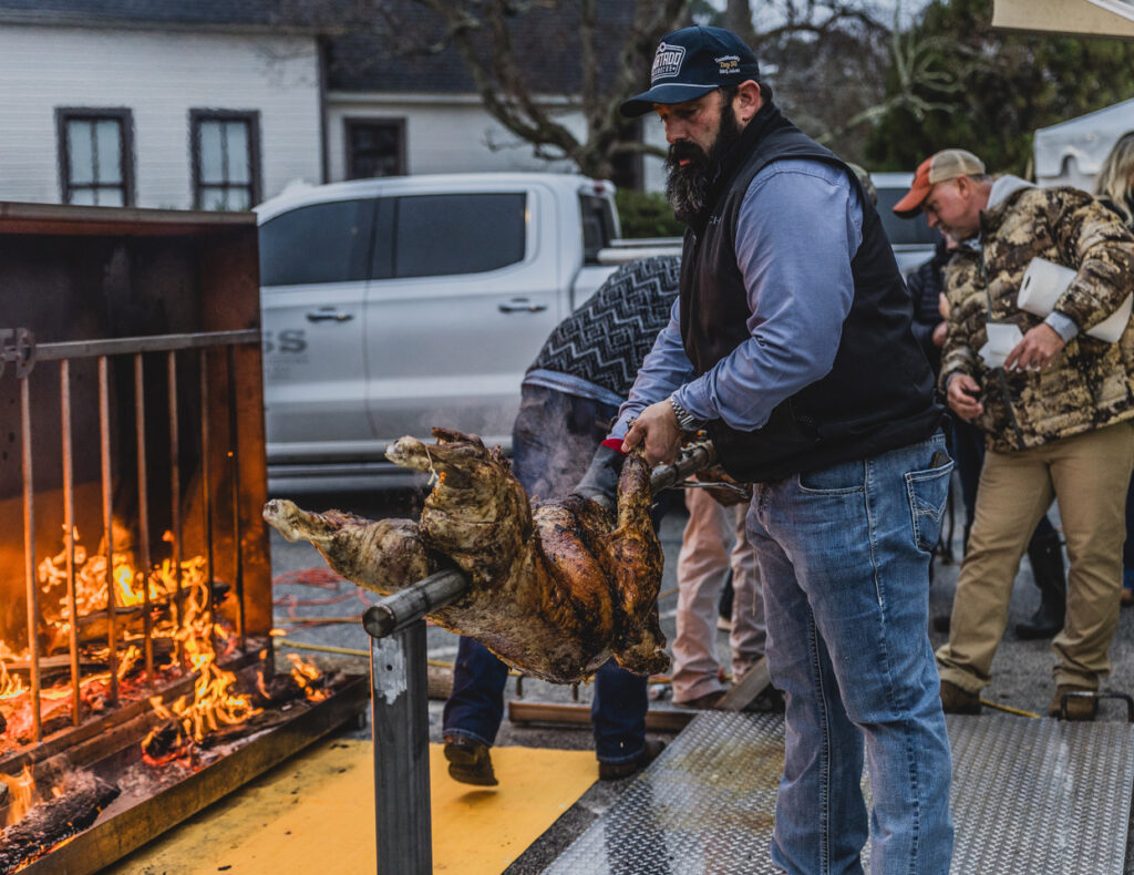 Meat roasting over an open flame at Pig In The Park.