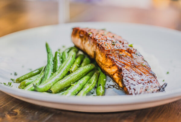 Plate of salmon and green beans at Deano's Italian are included in the guide to dining like the Irish.