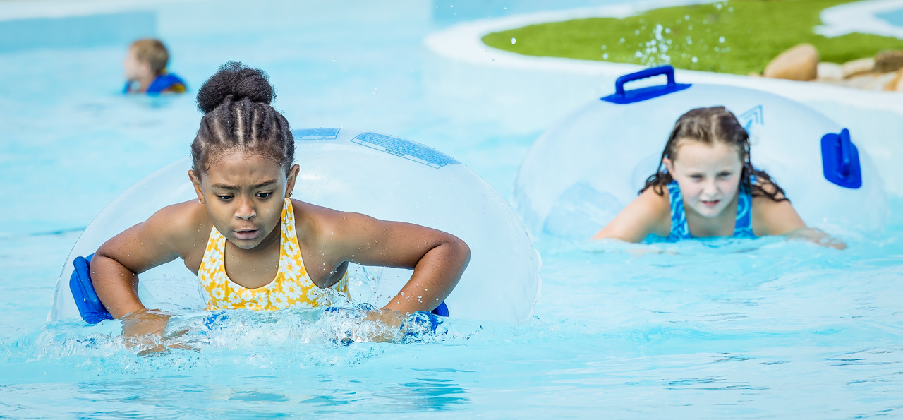 Children on tubes enjoying the lazy river at Southern Pines Water Park.