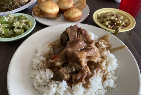 A heaping plate of beef and gravy over rice at Miller's Soul Food - Southern and Soul