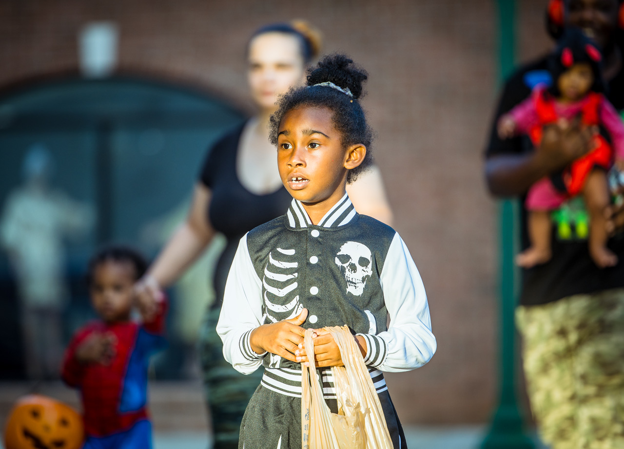 young girl dressed up in a skeleton jacket trick of treating in Downtown Dublin during Spooky Treats In The Downtown Streets.