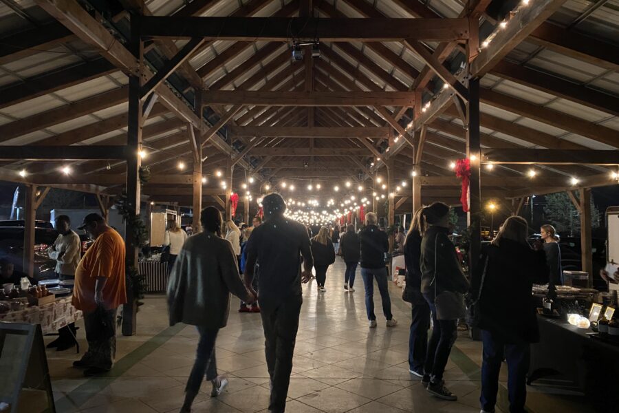 People peruse handmade items at Christmas at the Market