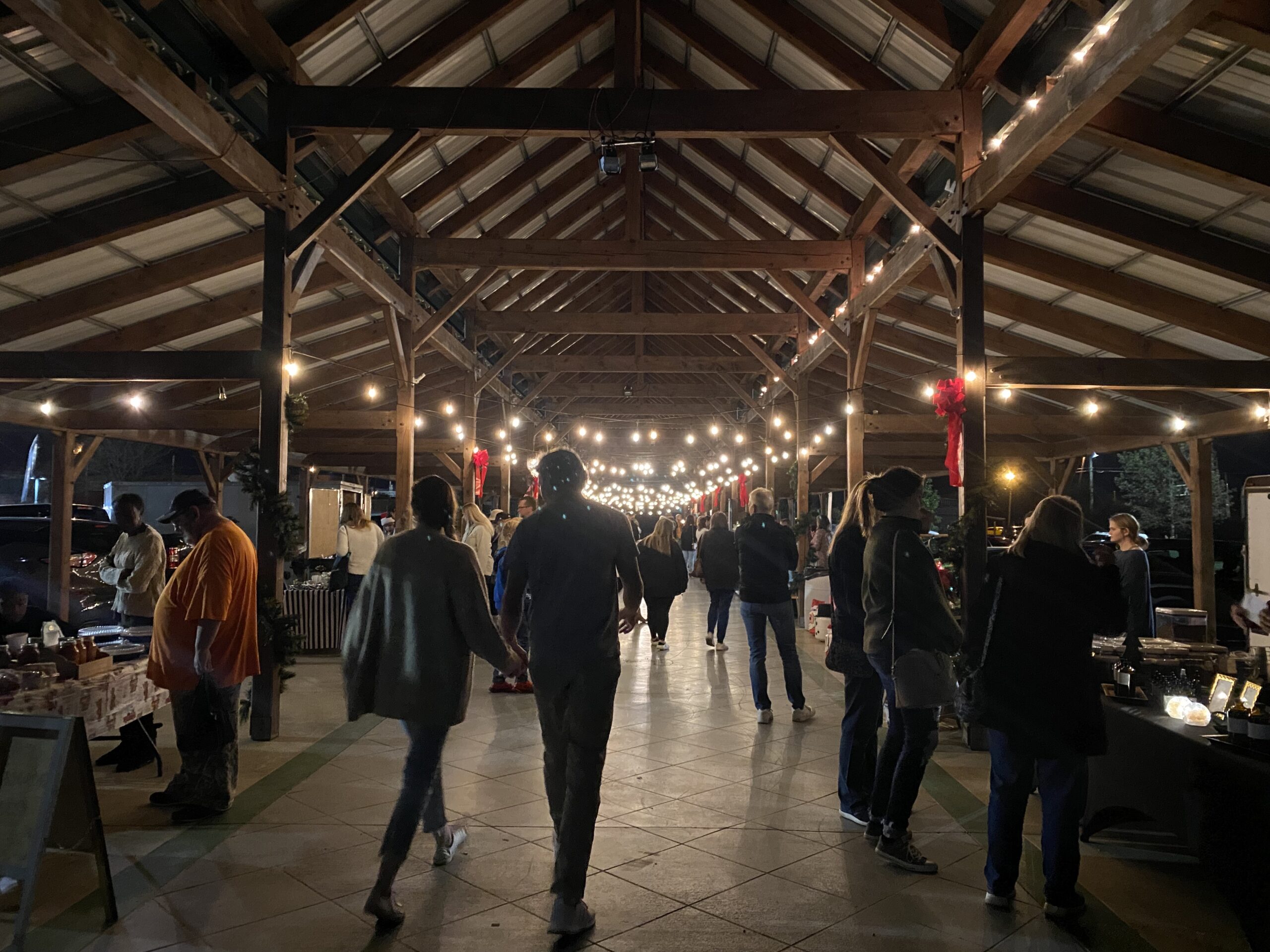 People peruse handmade items at Christmas at the Market