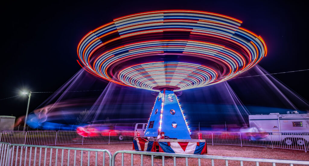 Ride with sparkly lights spins fast at the Civitan Fall Fair