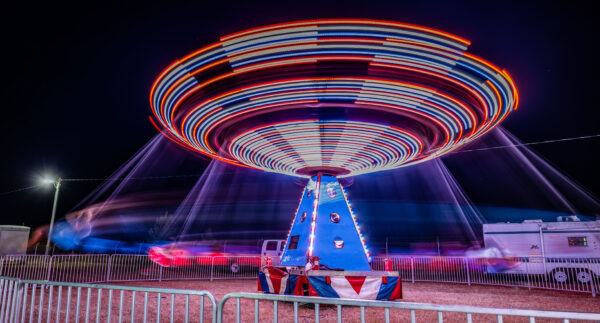 Ride with sparkly lights spins fast at the Civitan Fall Fair