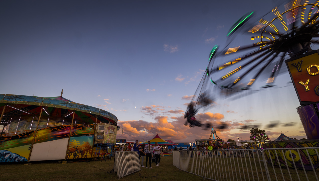 Fair ride lights sparkling as a sunset closes in at the Dublin Civitan Fall Fair.