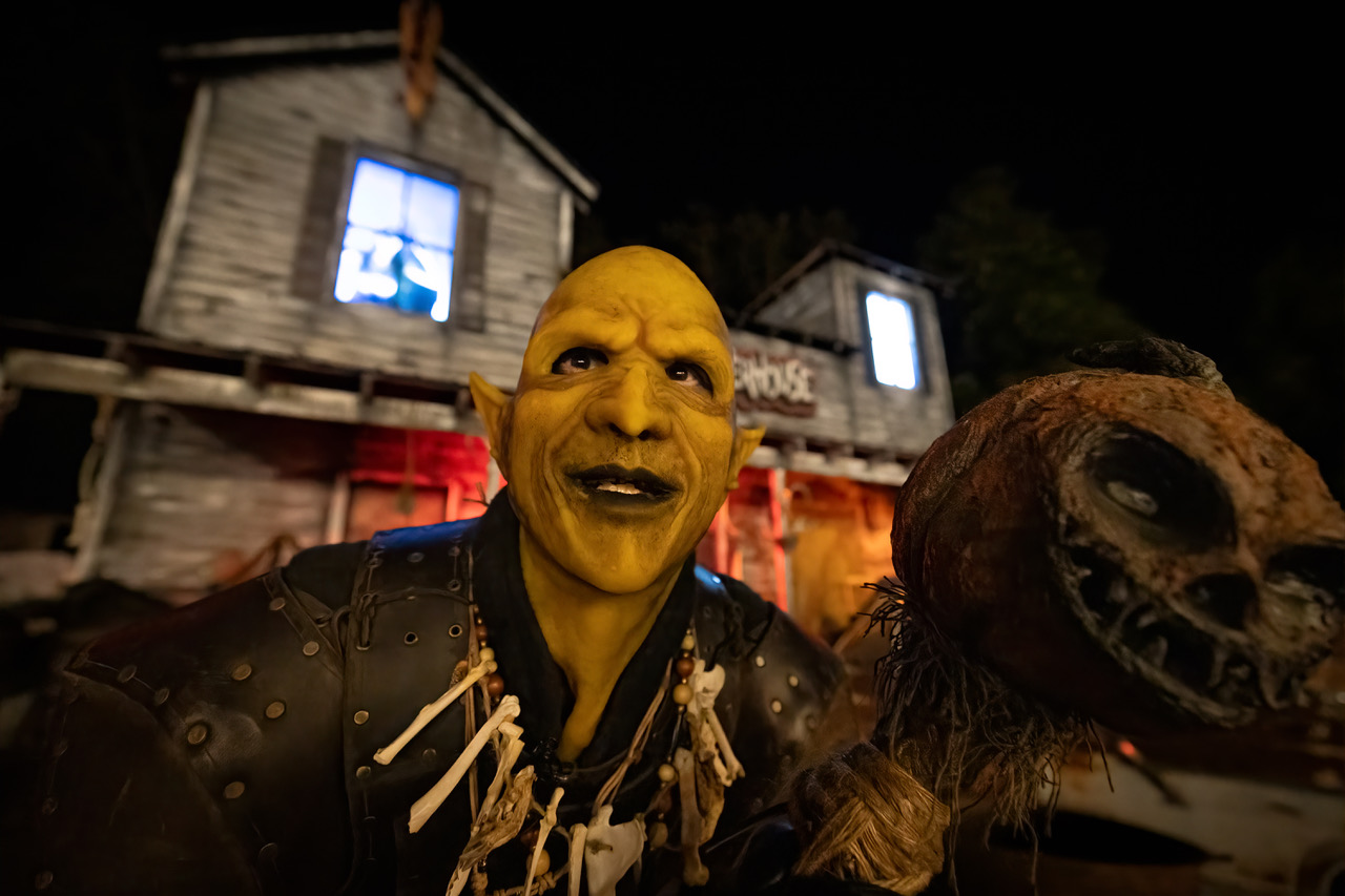 Scary green character in the shadows outside the Slaughterhouse at Haunted Montrose.