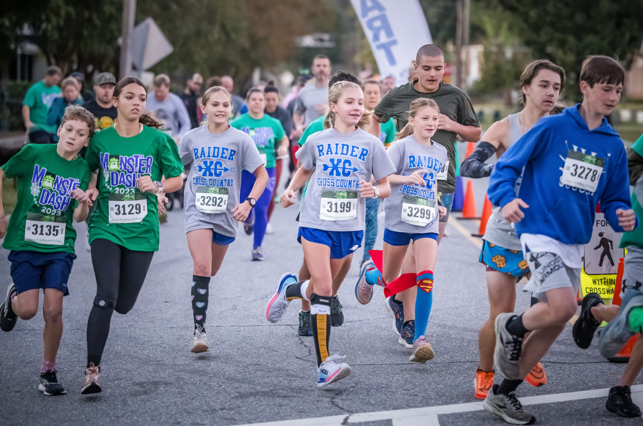 Kids dashing from starting line at Monster Dash.