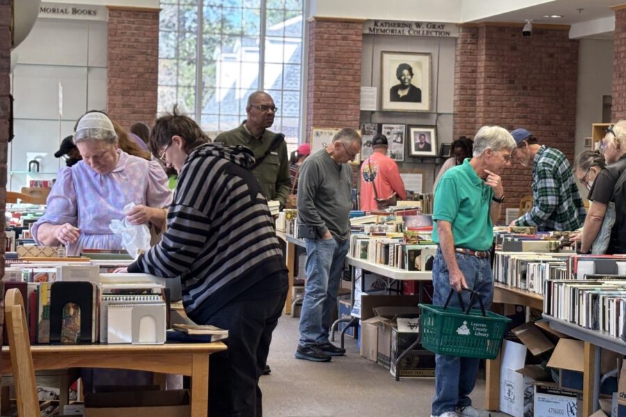 Library patrons peruse the tables at the St. Patrick's Book Sale