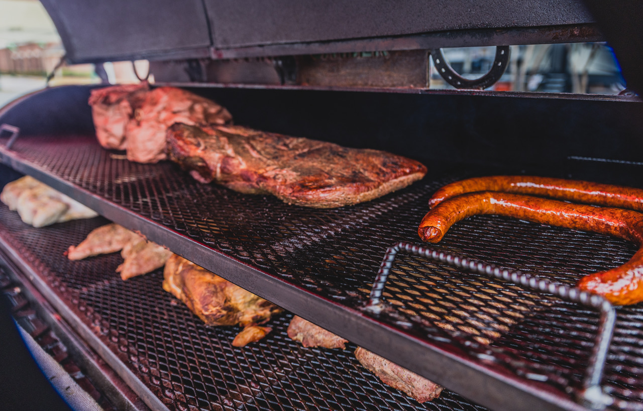 Grill filled with barbecue meats at Pig in the Park