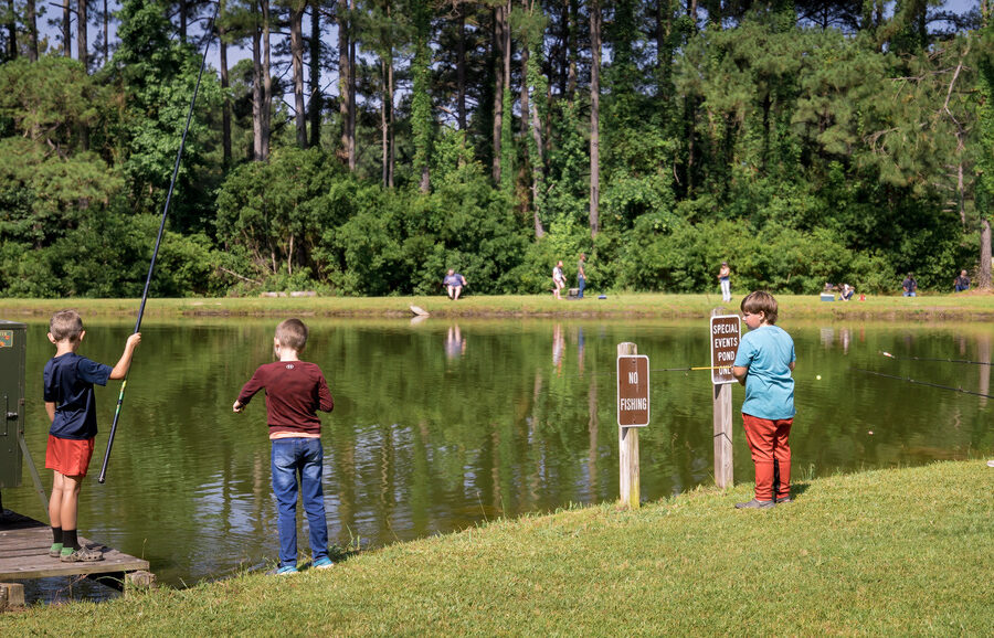 Little kids during free fishing day at Hugh Gillis PFA
