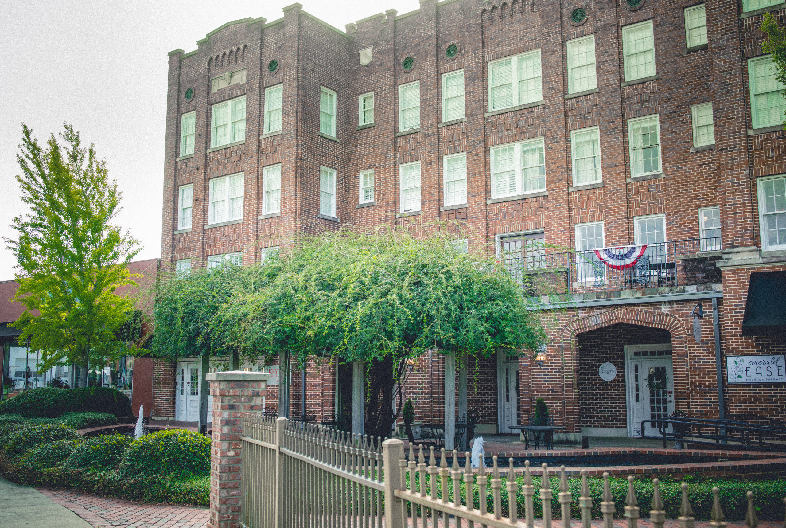 Exterior of the historic Fred Roberts building showing the Emerald Ease sign which is located in Suite 101.