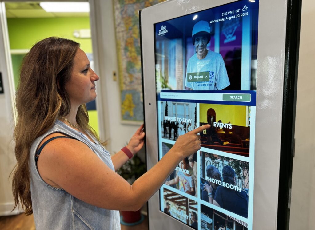 Visit Dublin GA director tests out the new digital kiosk