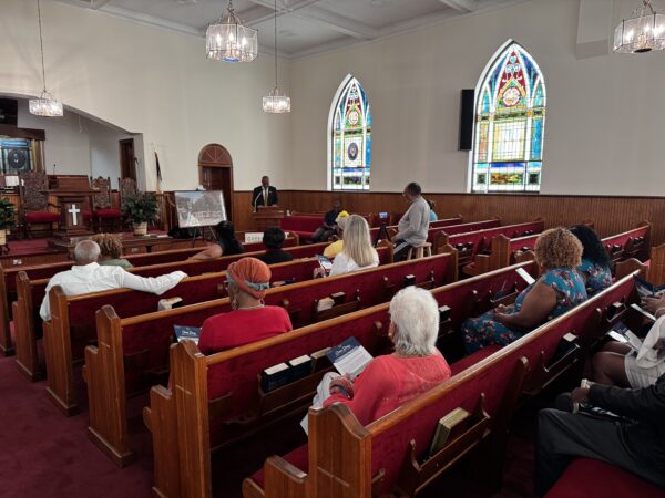 People sit in the pews of the First African Baptist Church during the One Day: Dublin's Civil Rights Experience