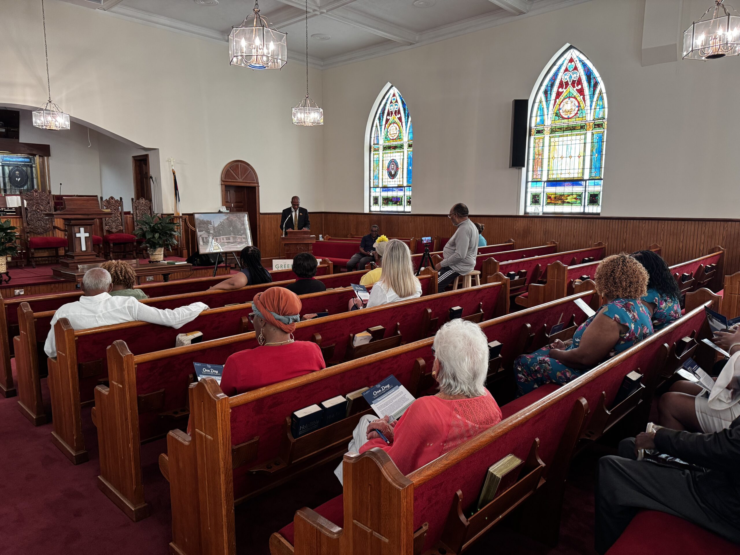 People sit in the pews of the First African Baptist Church during the One Day: Dublin's Civil Rights Experience