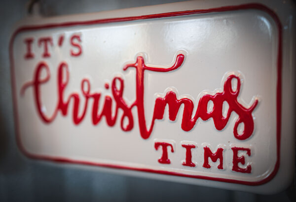 A decorative Christmas time sign, signaling the holidays, like the Christmas Tour of Homes.