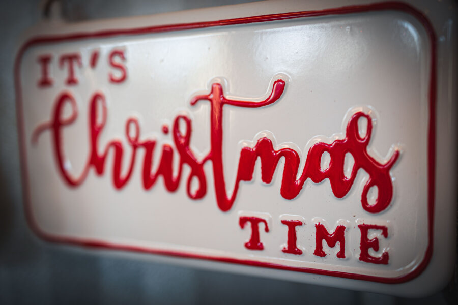 A decorative Christmas time sign, signaling the holidays, like the Christmas Tour of Homes.
