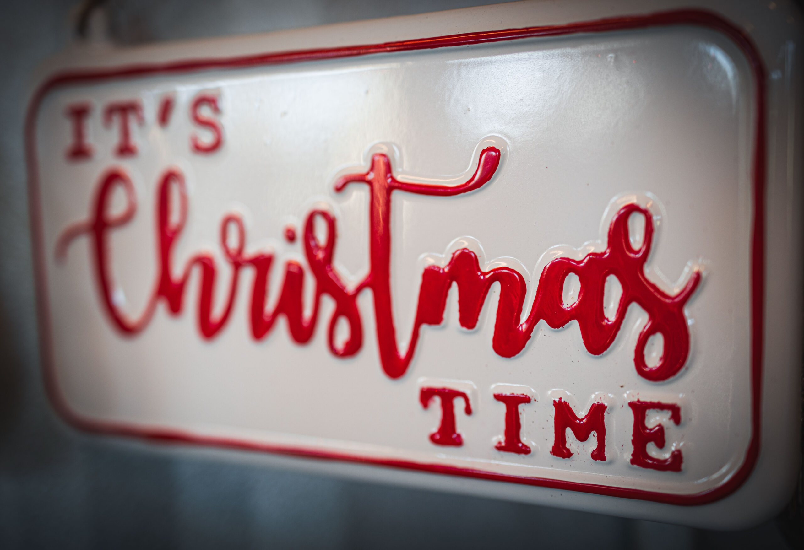 A decorative Christmas time sign, signaling the holidays, like the Christmas Tour of Homes.