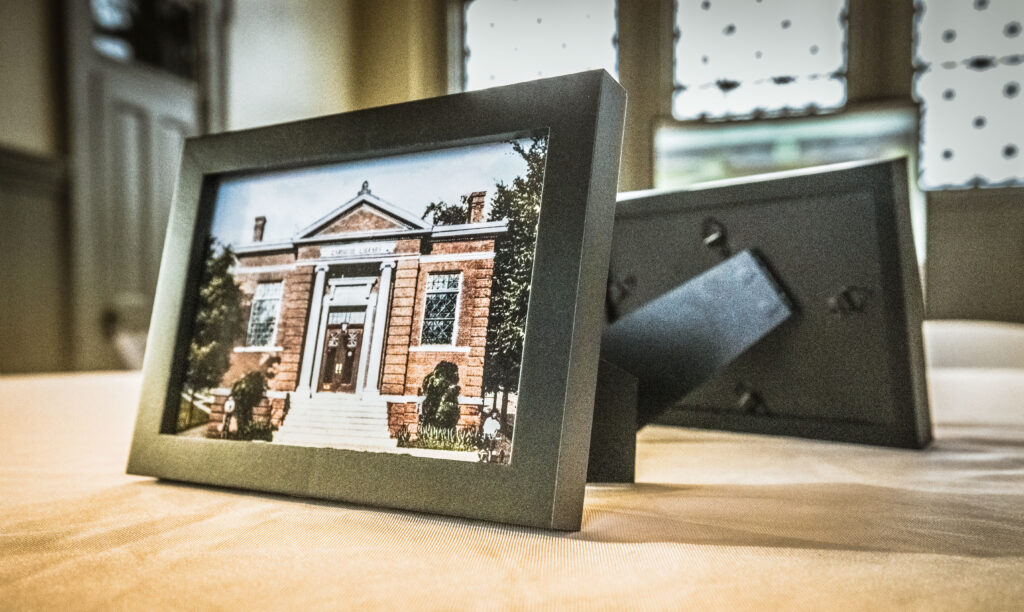 Framed postcard photo of historic Dublin Carnegie serving as table decor during an event.