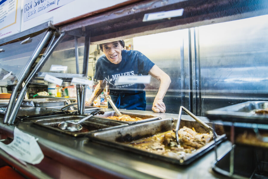 Nadine Hunt leans down to take your order at Miller's Soul Food.