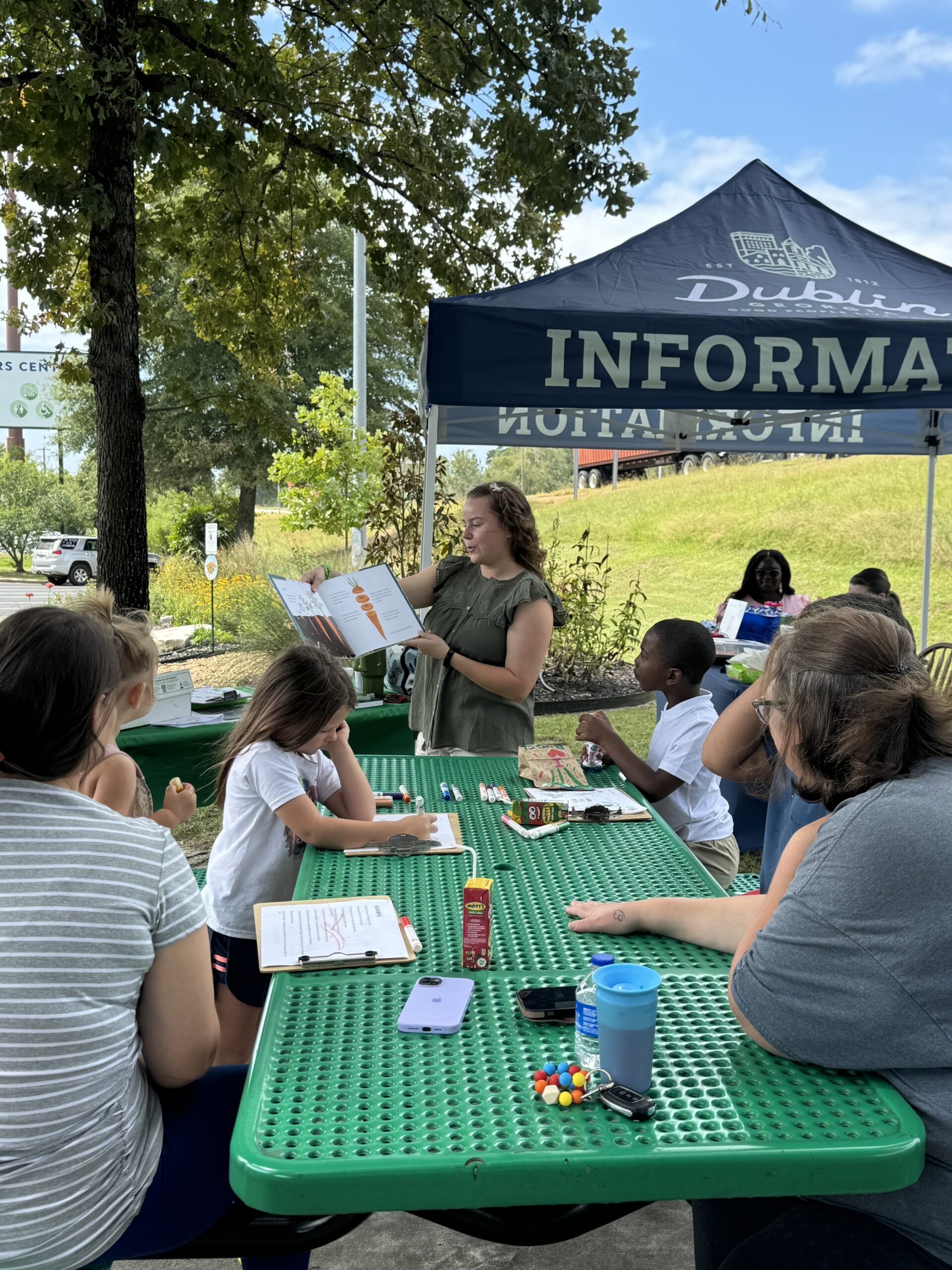 4-H Ambassador reads books to children during the Great Southeast Pollinator Census