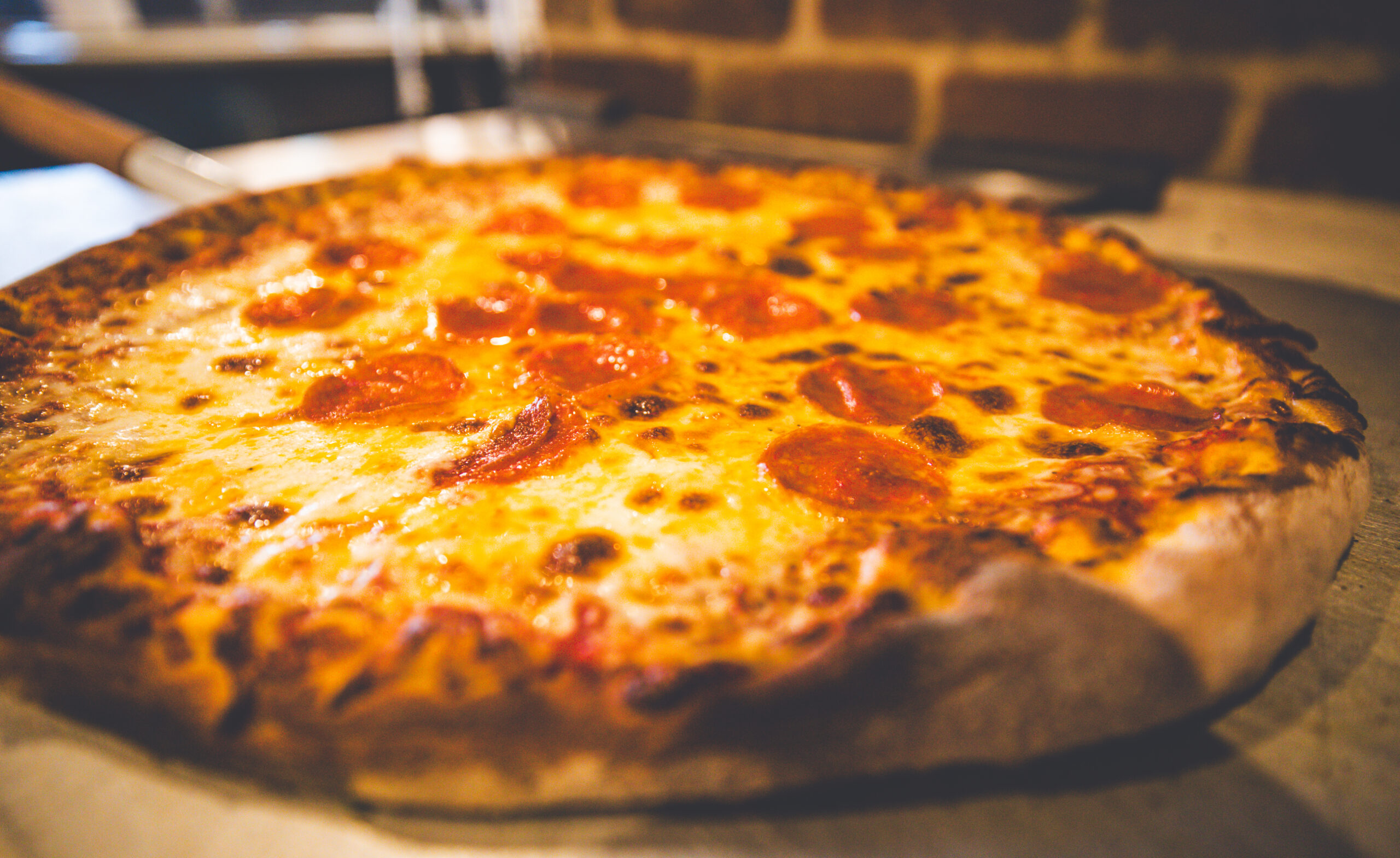 Gooey cheesy pepperoni pizza hot out of the oven at Dough Bros.