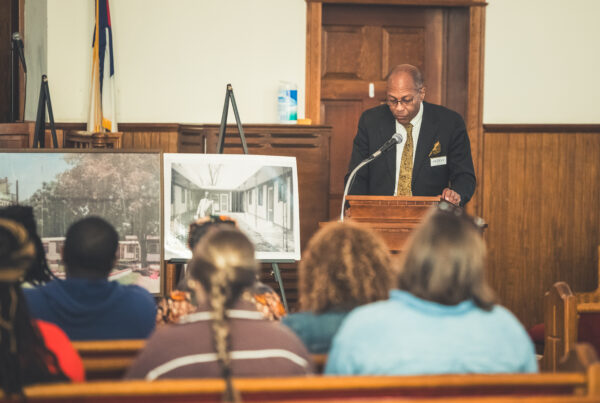 Carl Pearson, grandson of local entrepreneur Hub Dudley, stands at the podium of the First African Baptist Church, speaking to a crowd about a Dream in Dublin Georgia.