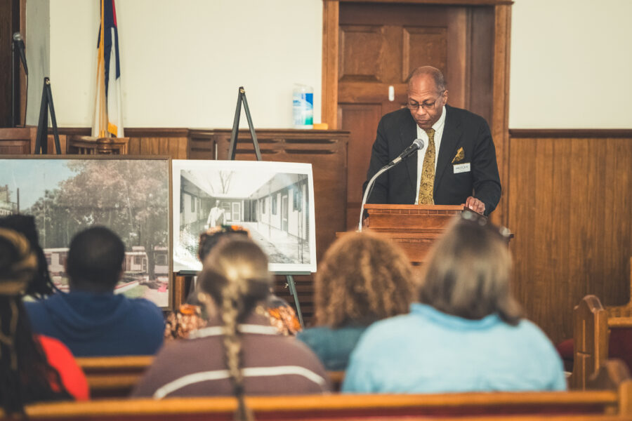 Carl Pearson, grandson of local entrepreneur Hub Dudley, stands at the podium of the First African Baptist Church, speaking to a crowd about a Dream in Dublin Georgia.