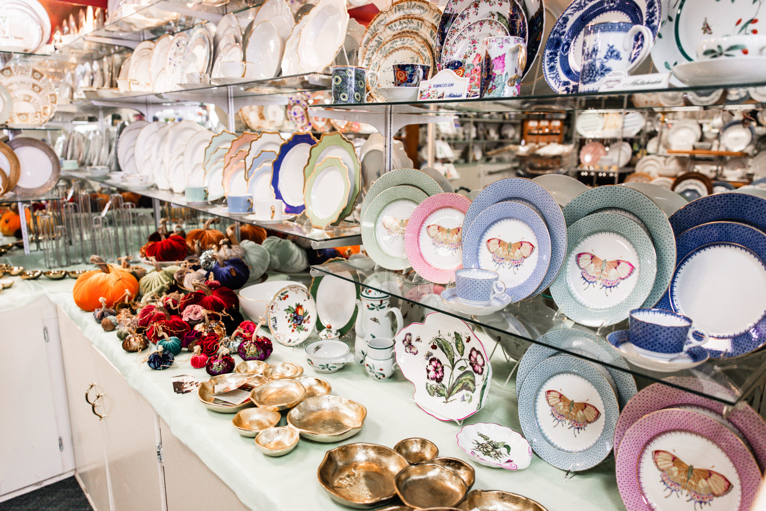 Colorful wall display of plates at Colleen's China.