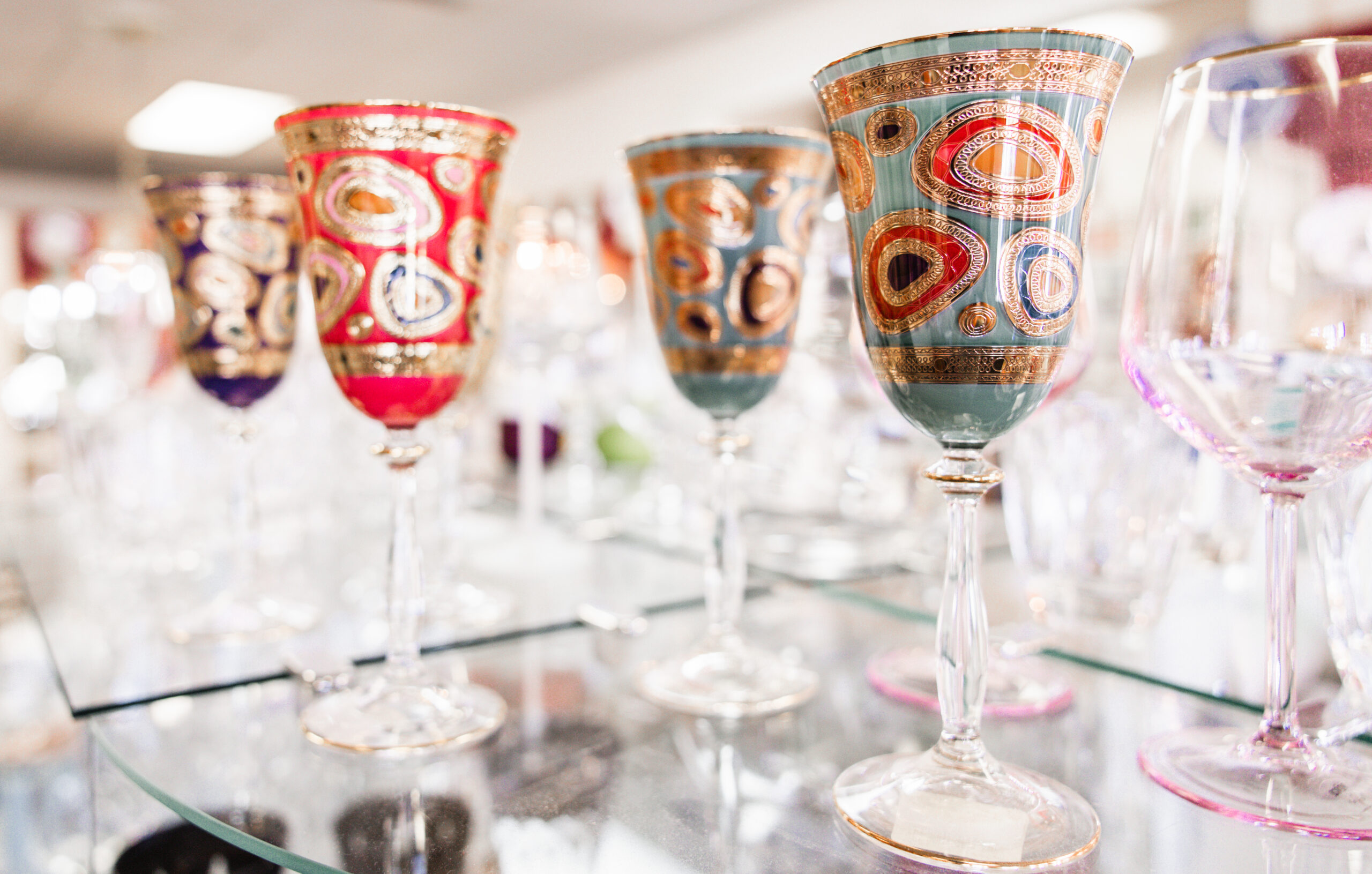Stemware with colorcul swirls in the glass.
